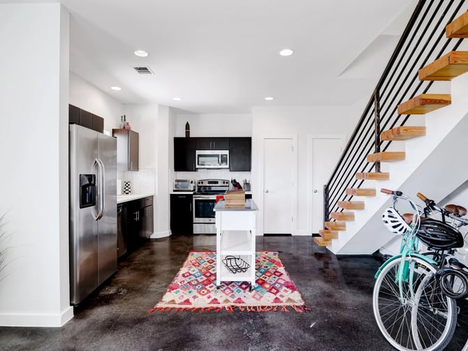 Urban duplex kitchen with floating staircase