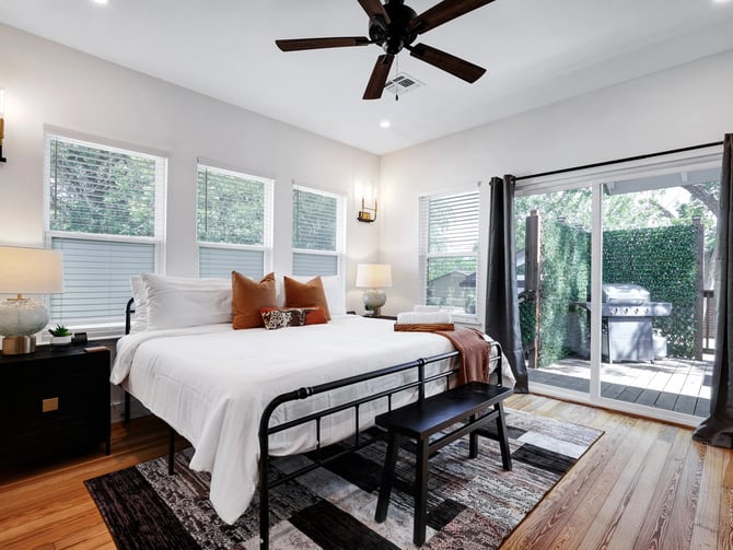 Casita bedroom with patio door and garden view